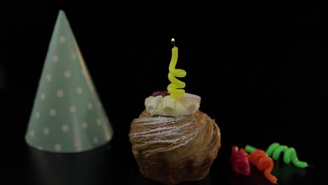 Party.-Cake-and-festive-candle-on-it.-Light-the-candle.-Celebrate-birthday