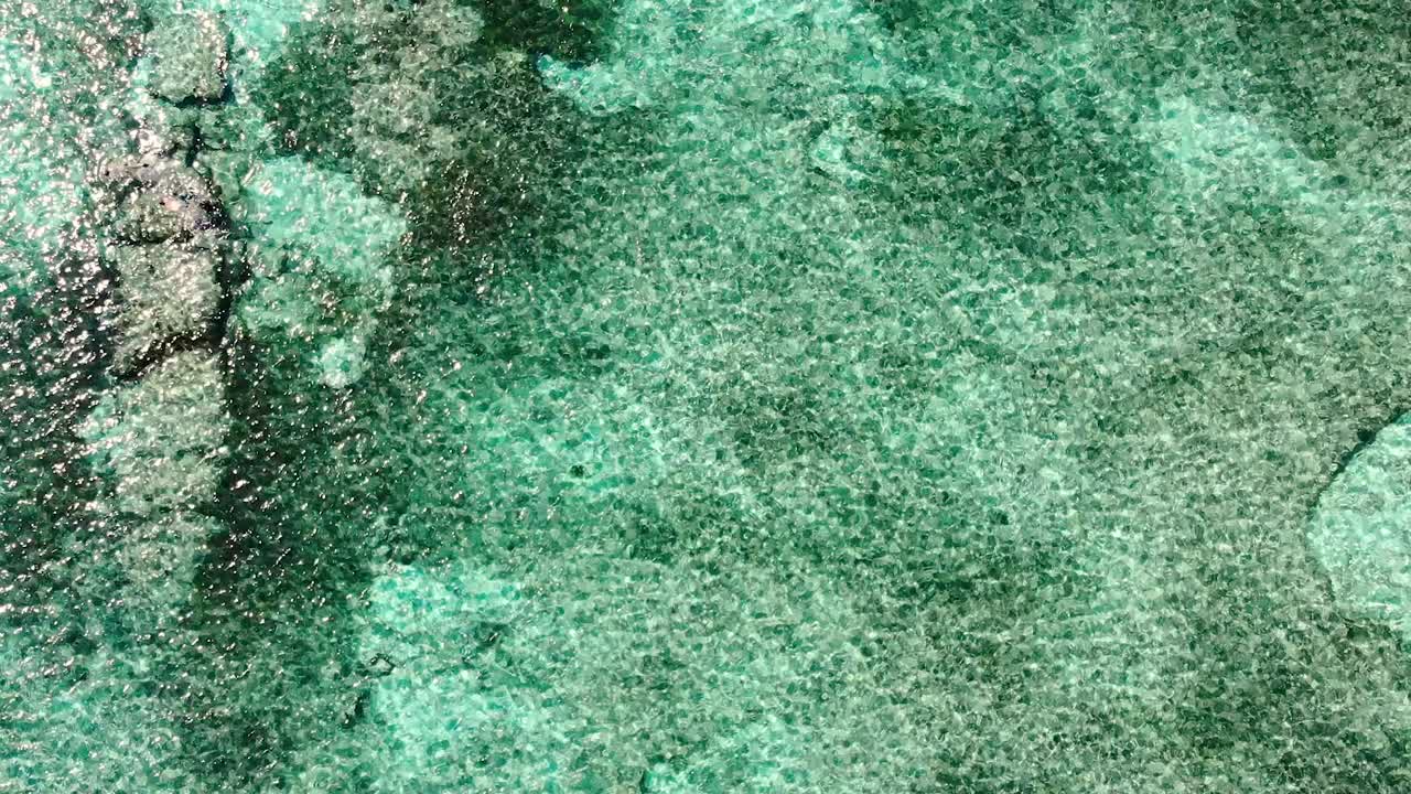 A Top-Down Aerial View Ascending of Cozumel's Crystal Clear Waters in Mexico