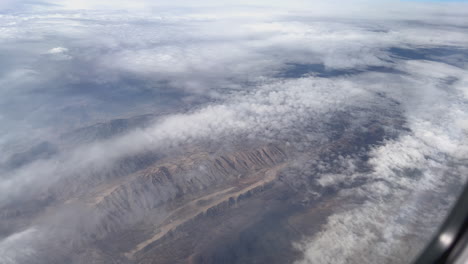 aerial view of mountainous landscape with clouds