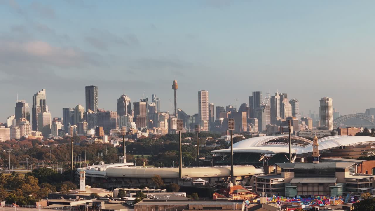Aerial cityscape of Sydney with buildings, skyline and clear across harbor and water, establishing overview