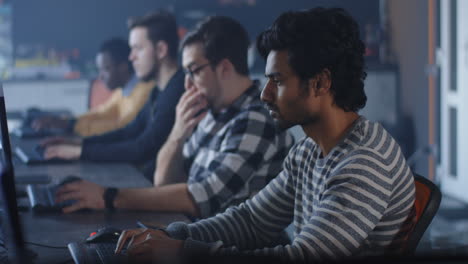 team of programmers working on computers