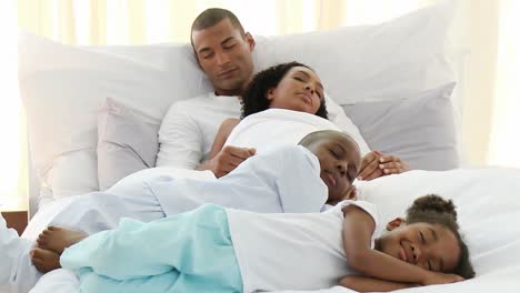 AfroAmerican-children-sleeping-with-their-parents