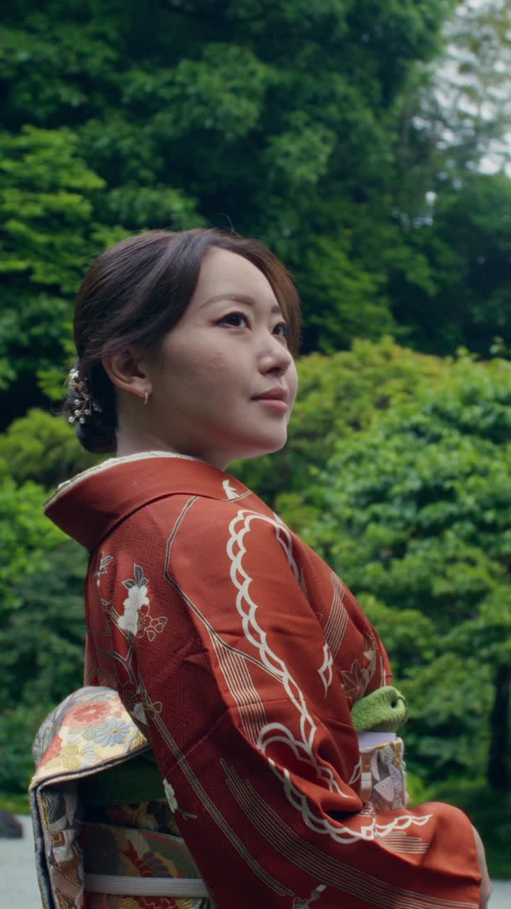 Woman in Kimono in a Japanese Garden