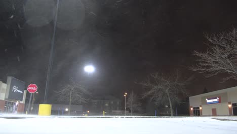 snow storm at night, strong wind and empty city, bad weather conditions, static shot.