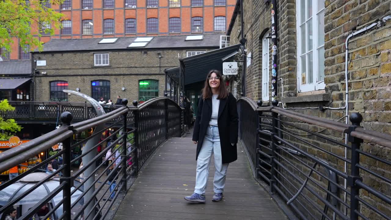 Woman Walking on a Bridge in Camden, London