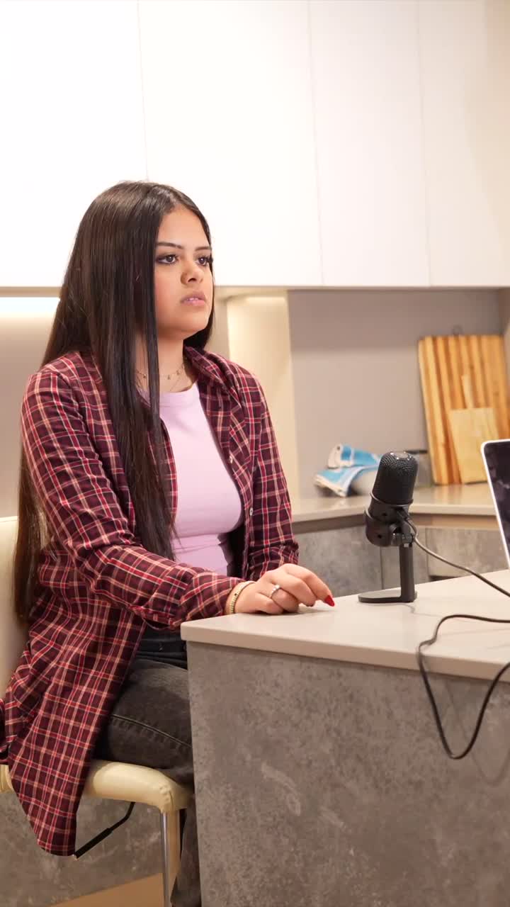 Woman Recording Podcast in Kitchen