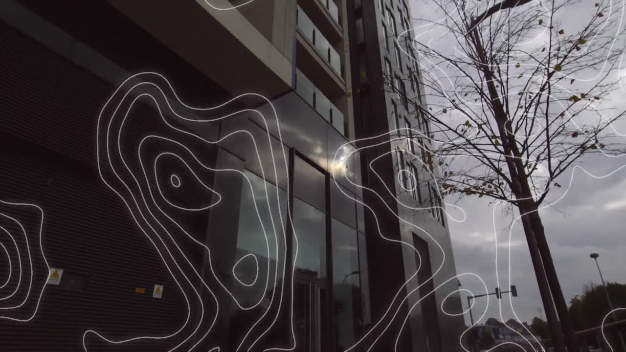 Digital composition of topography against tall buildings in background