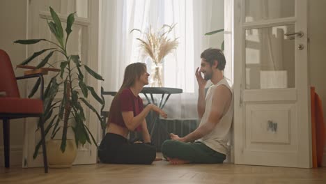 couple meditating at home