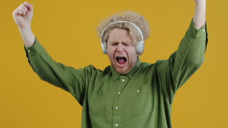 man dancing and enjoying music