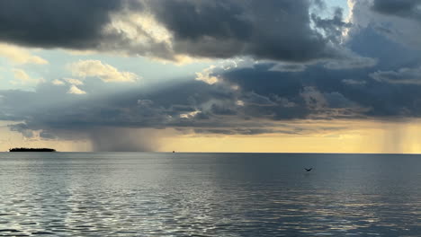 rain storm in the distance off florida keys, calm before the storm