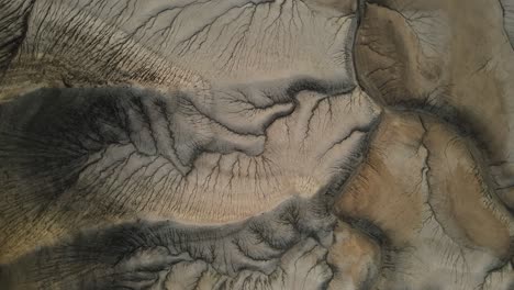 aerial rotating view of rugged badlands near factory butte, utah