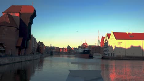 building-facades-at-riverbank,-black-crane-and-national-Maritime-Museum-at-Gdansk-Poland