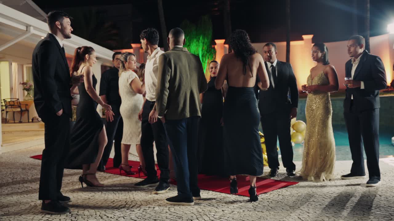 Elegant Night Party by the Pool with People on a Red Carpet