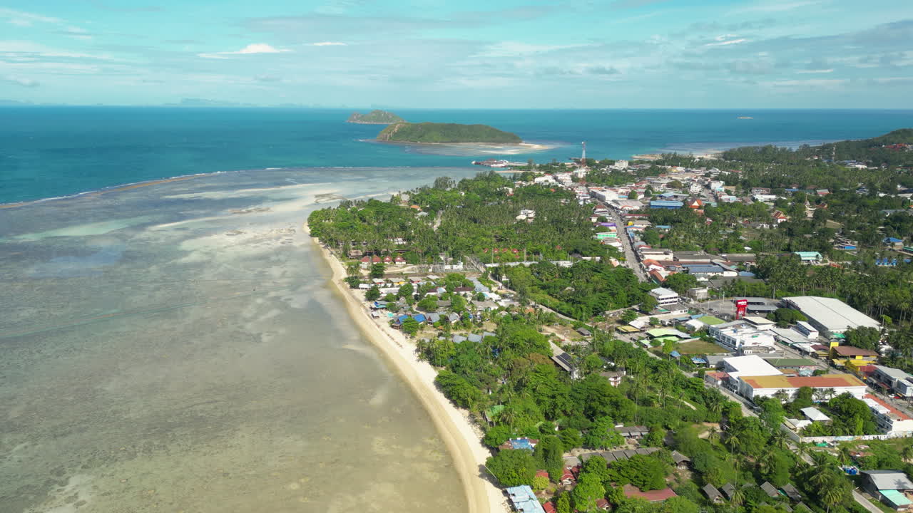 Koh Phangan Island aerial shot with Thongsala Pier, ko tae nai island, and Koh Tau Island, drone shot orbital