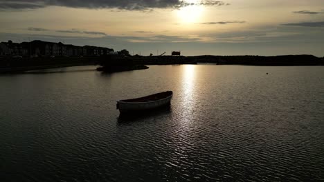 Slow-northerly-orbit-of-empty-boat-on-lake-in-slow-motion-at-the-Boating-Lakes-Fleetwood-Lancashire-UK