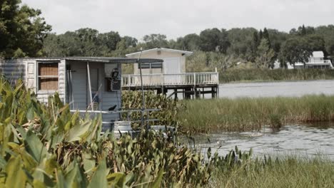 a boat house floating on the lake