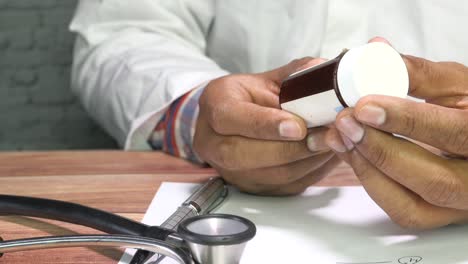 doctor holding a medicine bottle