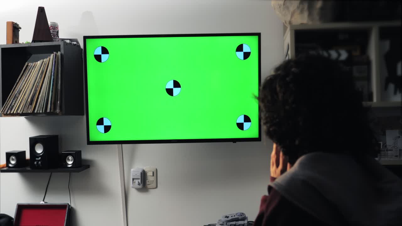 Green Screen TV with Tracking Markers Mounted on a Wall