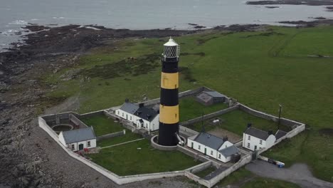 aerial view of st john's point lighthouse on a cloudy day, county down, northern ireland