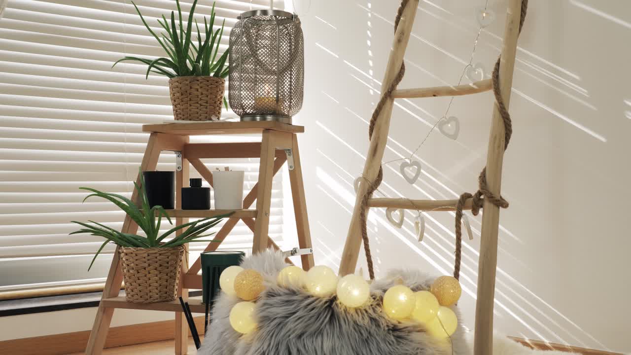 Stylish home decor setup with wooden furniture, plants and soft lighting creating a cozy ambiance