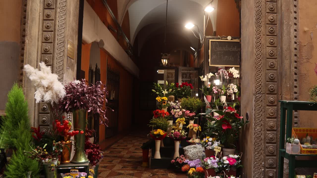 Flower arrangements displayed outside a shop in Bologna’s old town.