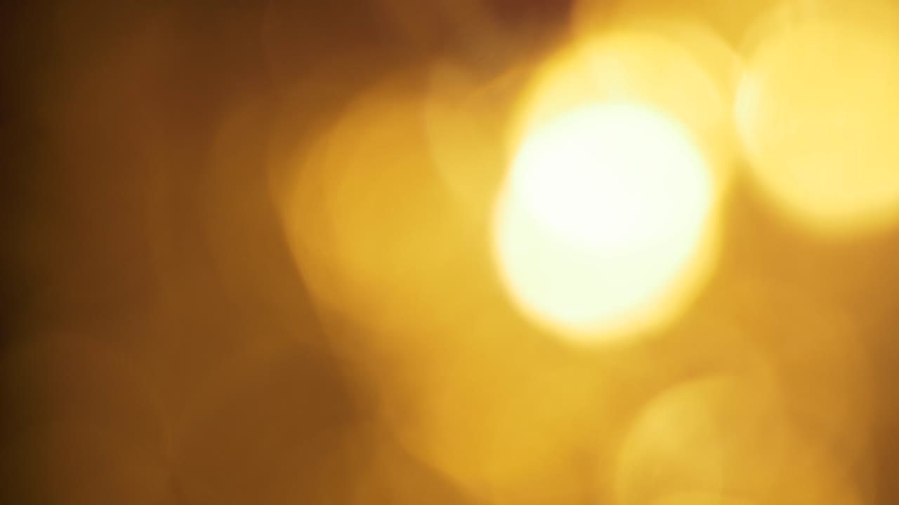 Morbidi Cerchi di Luce Bokeh Dorati che Appaiono e Svaniscono