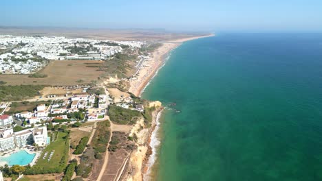 aerial panorama of the sandy shores and clear waters of conil de la frontera