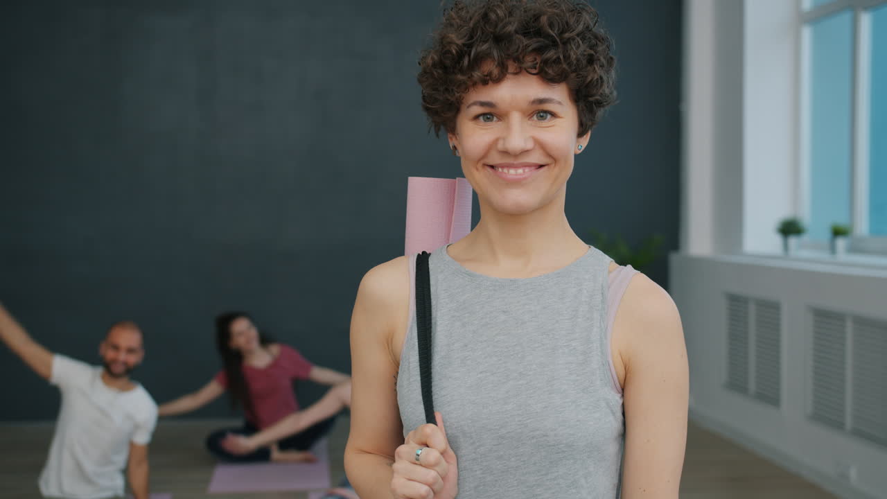 Woman Yoga Instructor with Yoga Mat