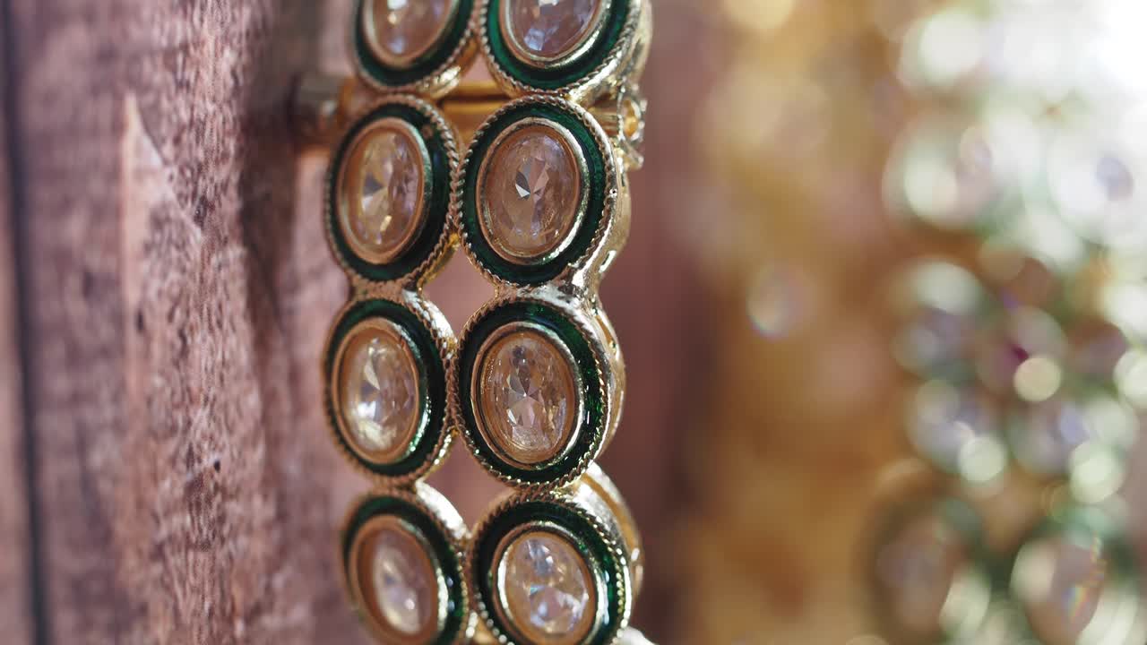 Close-up of Indian Gold Bangles with Gems