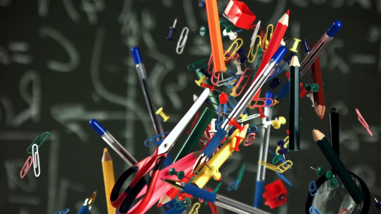 Colorful School and Office Supplies Floating Against a Chalkboard with Math Equations
