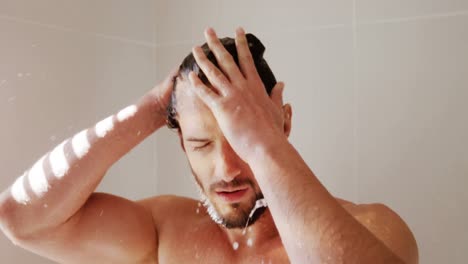 Man-taking-a-shower-in-bathroom