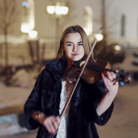 playing violin instrument in the winter time