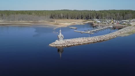 rocky shore with a small orthodox chapel aerial view