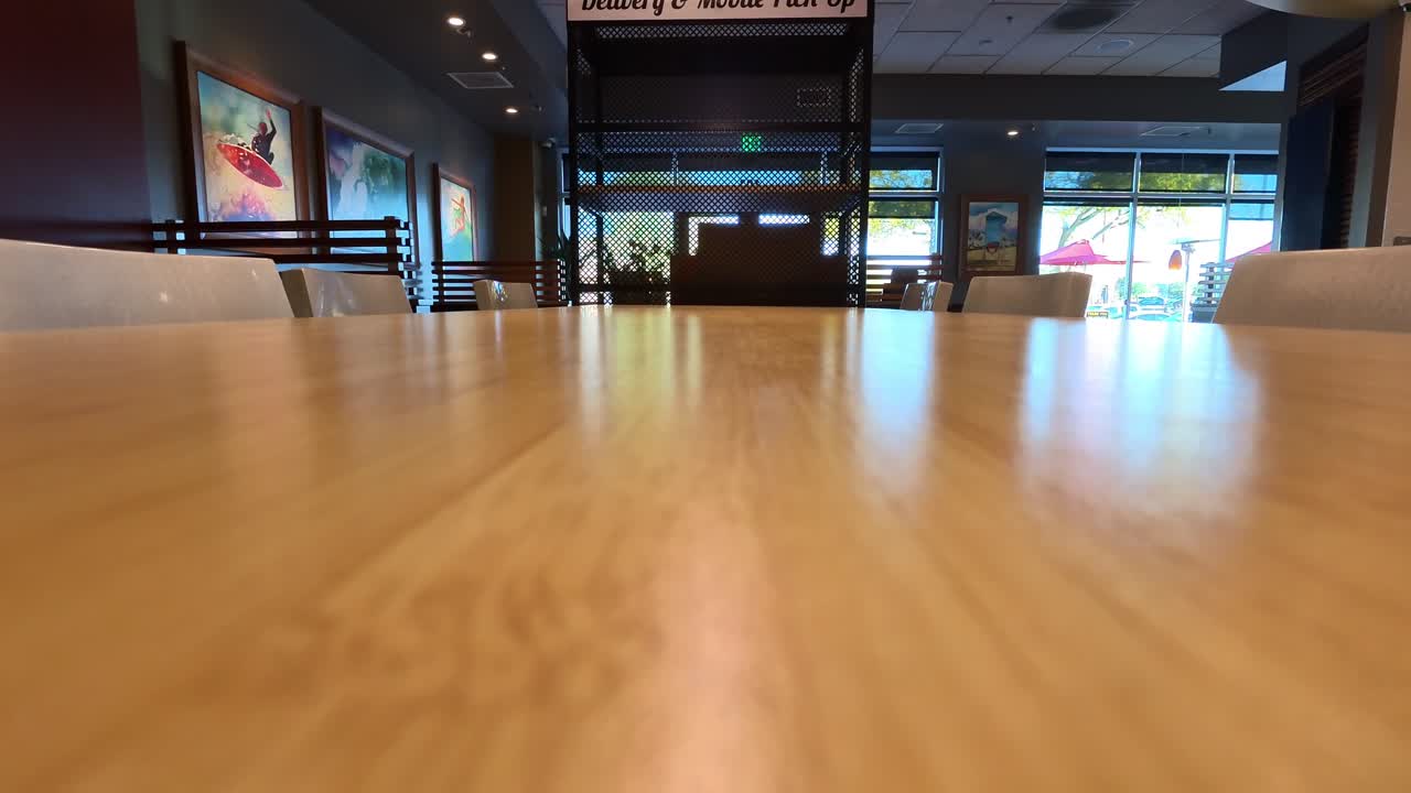 Interior of restaurant chain during day.