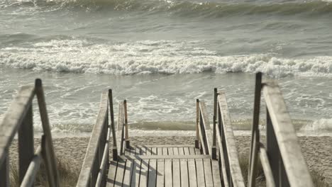 Boardwalk-to-the-beach-of-Sylt-with-the-Northsea-in-the-background-4k-60fps