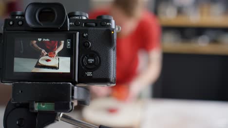 camera filming food blogger preparing pizza