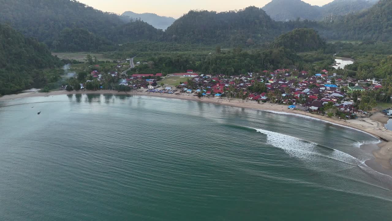 Drone aerial view of indonesian coastline padang west sumatra tropical ocean rainforest jungle trees