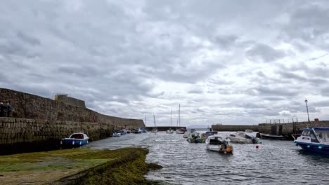 boats docked in a scottish harbor