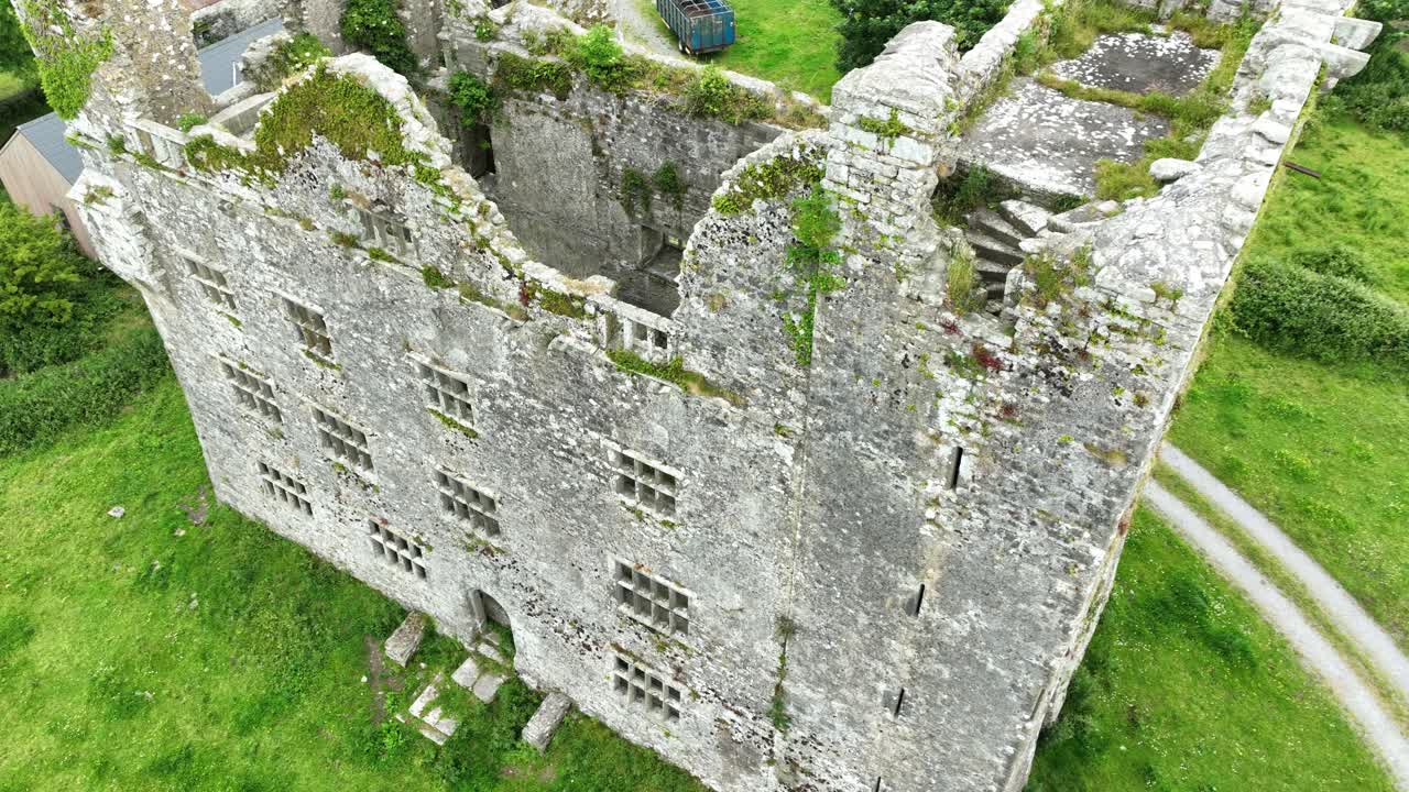 Castles In Ireland drone high view of the ruins of Leamenah castle Co.Clare imposing landmark and tourist destination Epic Locations