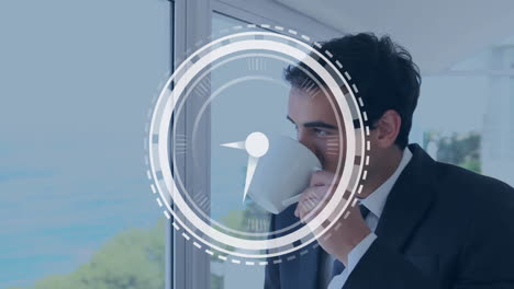 animation of clock moving over caucasian businessman drinking coffee