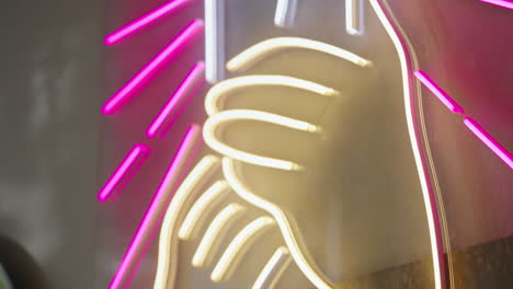 pink and white neon thumbs up sign