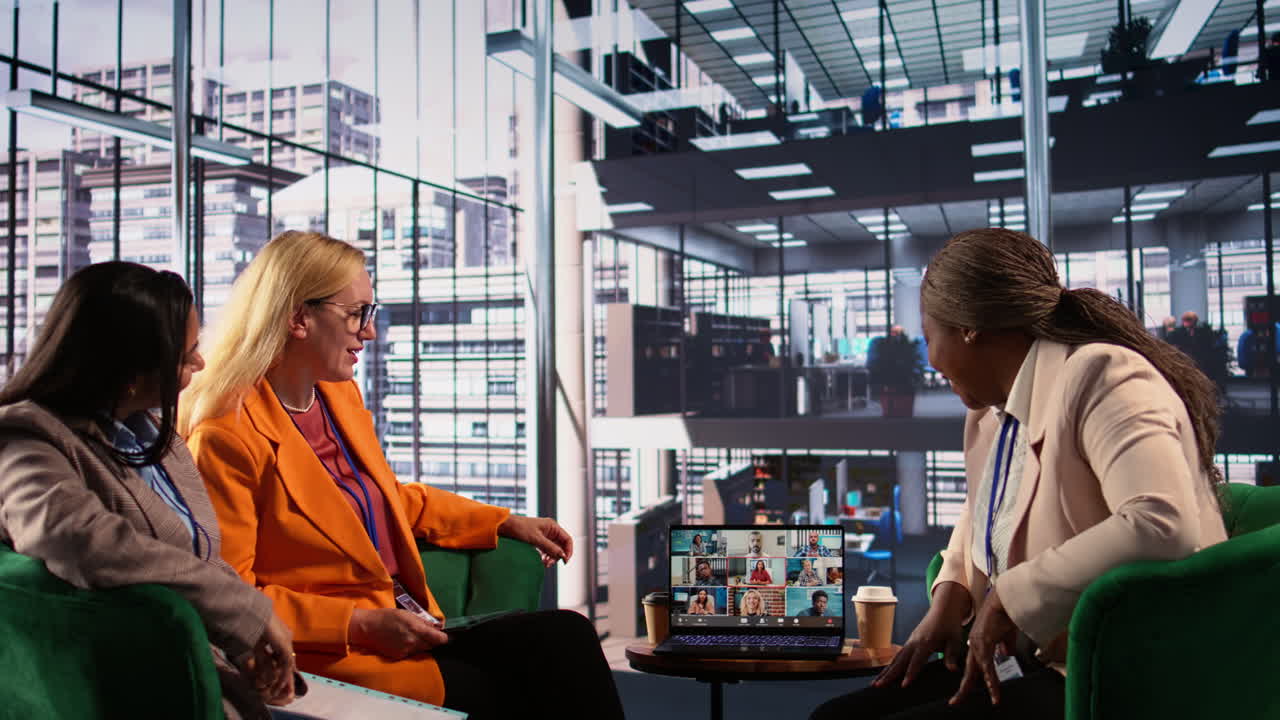 Business Women in Office Meeting with Video Call on Laptop