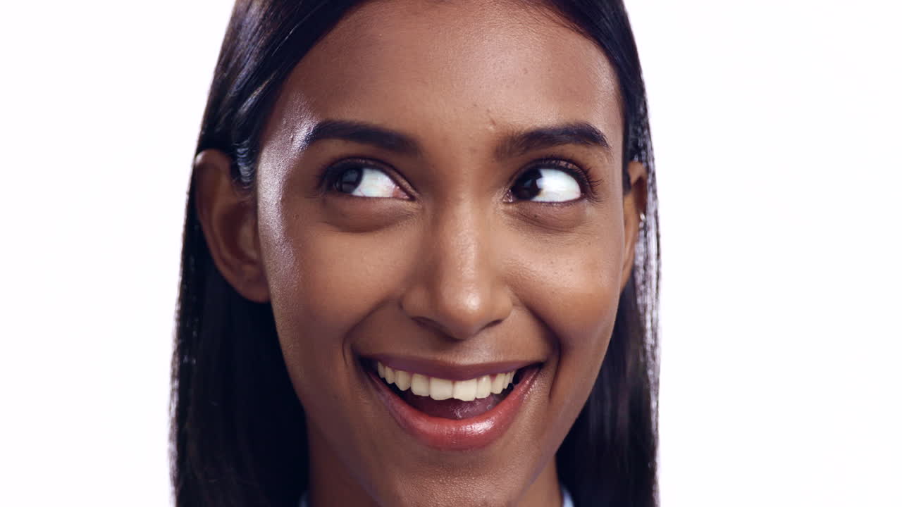 Smile, thinking and face of a woman in studio