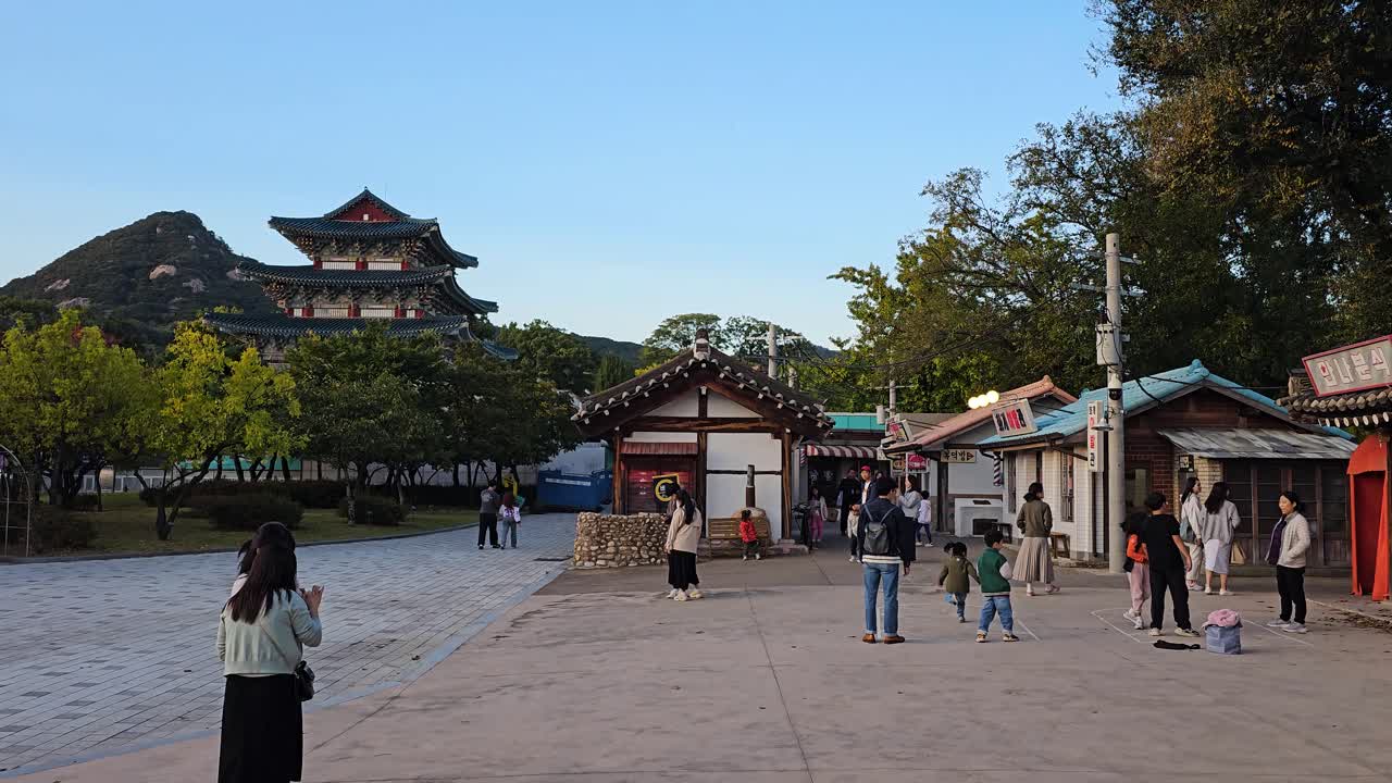 Children And Families At National Folk Museum, Street Of Memories In Seoul, South Korea. Pan Left Shot