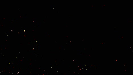 4k fire particles over black background flying embers from fire smoke motion of fiery orange red