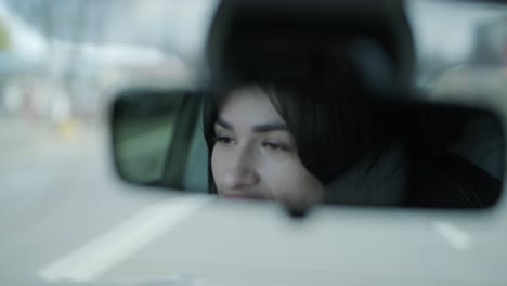 confident businesswoman driving her car, dressed in elegant business attire, showcasing independence and professionalism in a modern vehicle interior