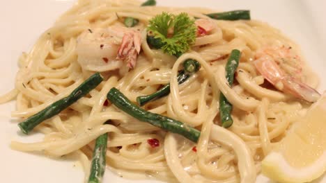 Plate-of-sea-food-pasta-on-table