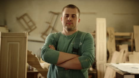 cheerful woodworker looking at camera indoors