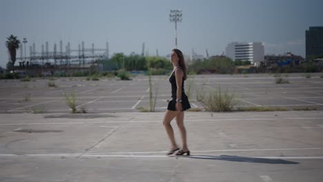 woman walking in an empty parking lot