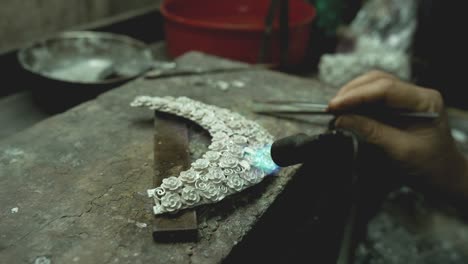 jeweler at work in jewelry. desktop for craft jewelry making with professional tools. close up view of tools. thailand.